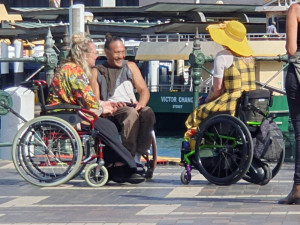 Robin, Sarah and Rodney, laughing and chatting after the busker finished his song.